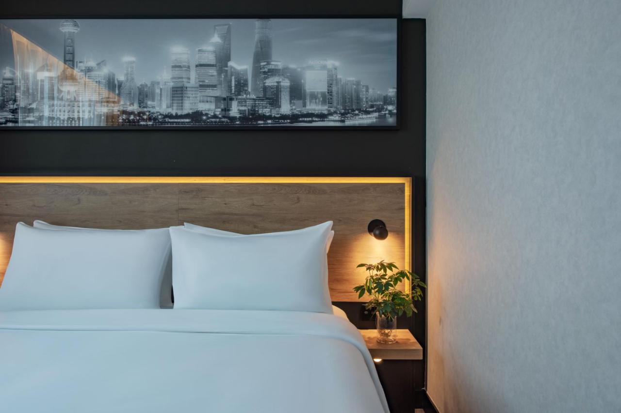 Park Inn By Radisson Shanghai Huanqiugang Buitenkant foto